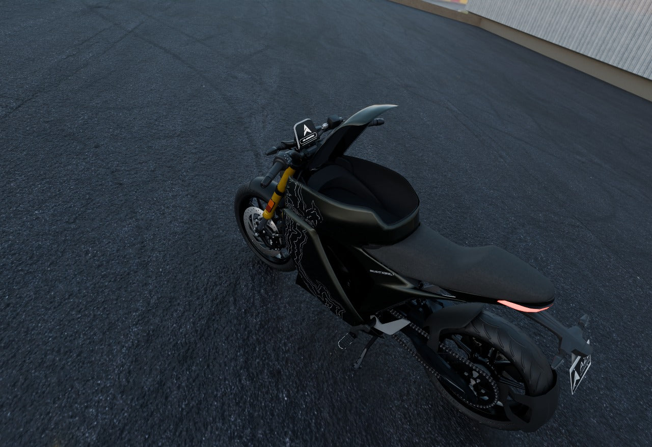 Black electric motorcycle parked on a dark asphalt surface